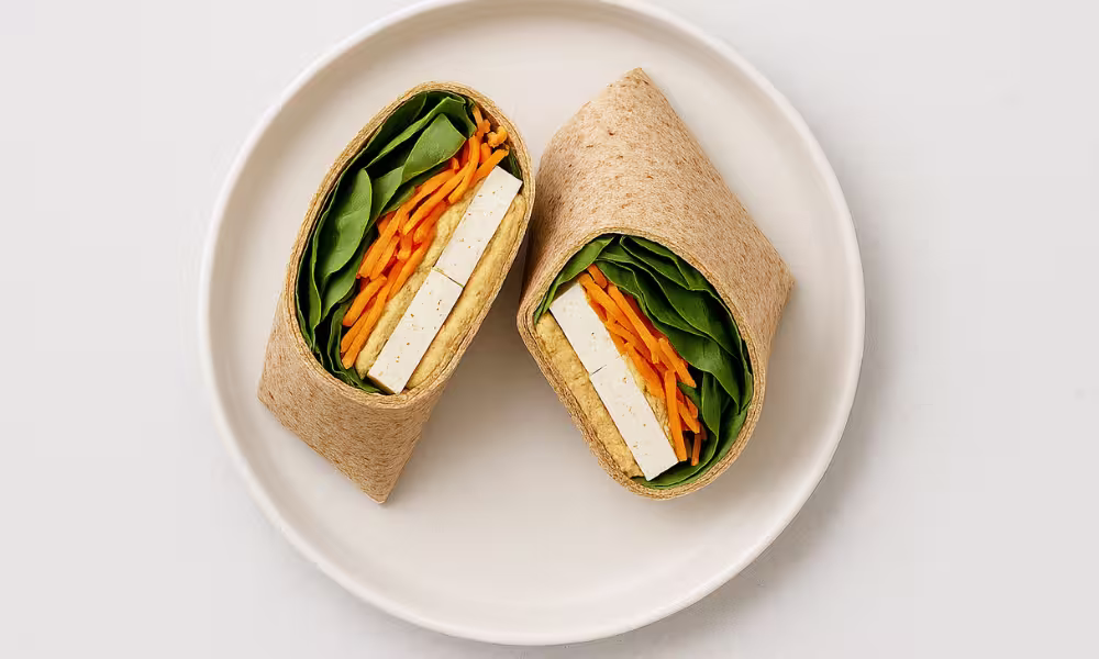 Protein-packed no-cook breakfast wrap with tofu, hummus, and vegetables