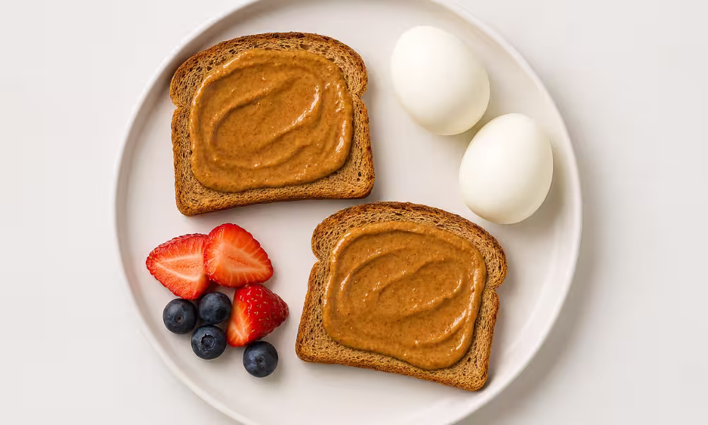 No-cook high-protein breakfast with almond butter toast and boiled eggs on a plate