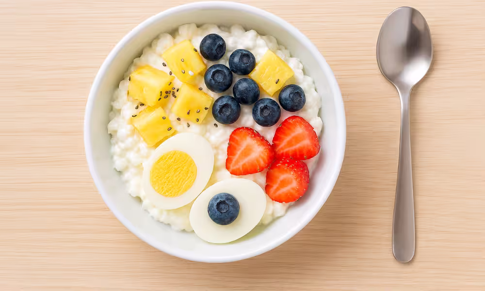 High-protein cottage cheese breakfast bowl with pineapple, berries, and chia seeds
