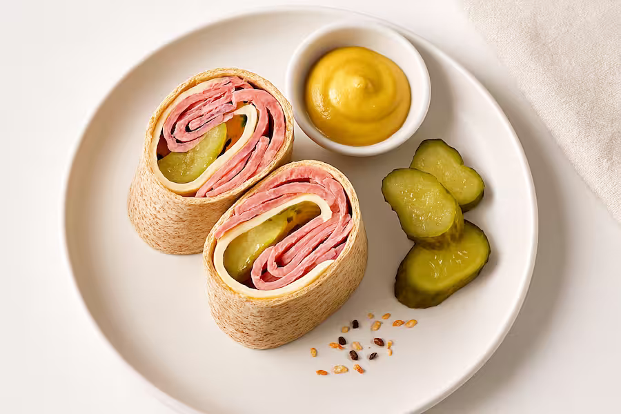 “Mini whole-wheat wraps with roast beef, cheese, pickles, and mustard — high-protein snack.”